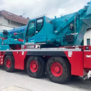 A large crane on the back of a truck.